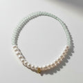 The Mermaid's Den Statice Sinensis bracelet featuring light green Aventurine beads and white freshwater pearls.