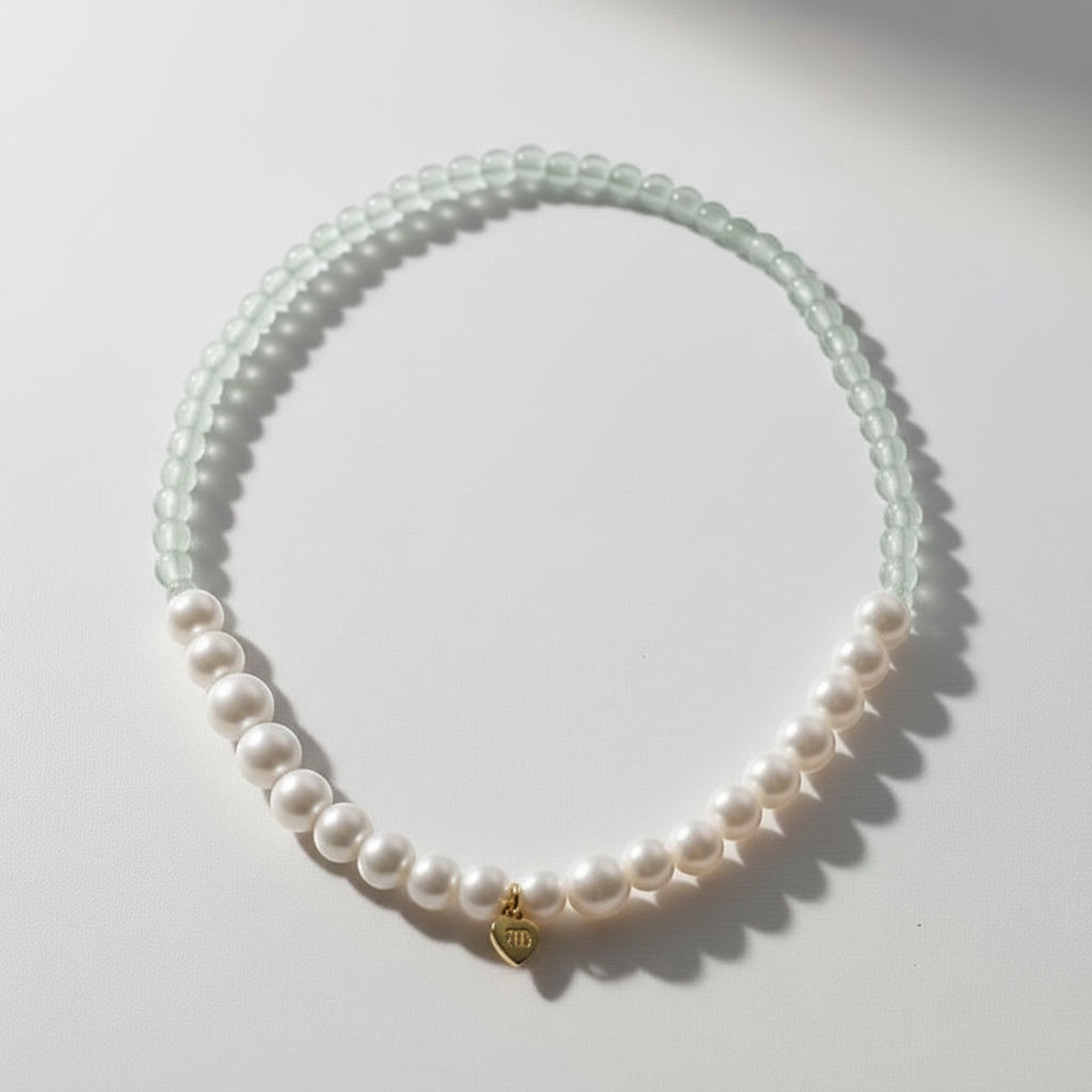 The Mermaid's Den Statice Sinensis bracelet featuring light green Aventurine beads and white freshwater pearls.