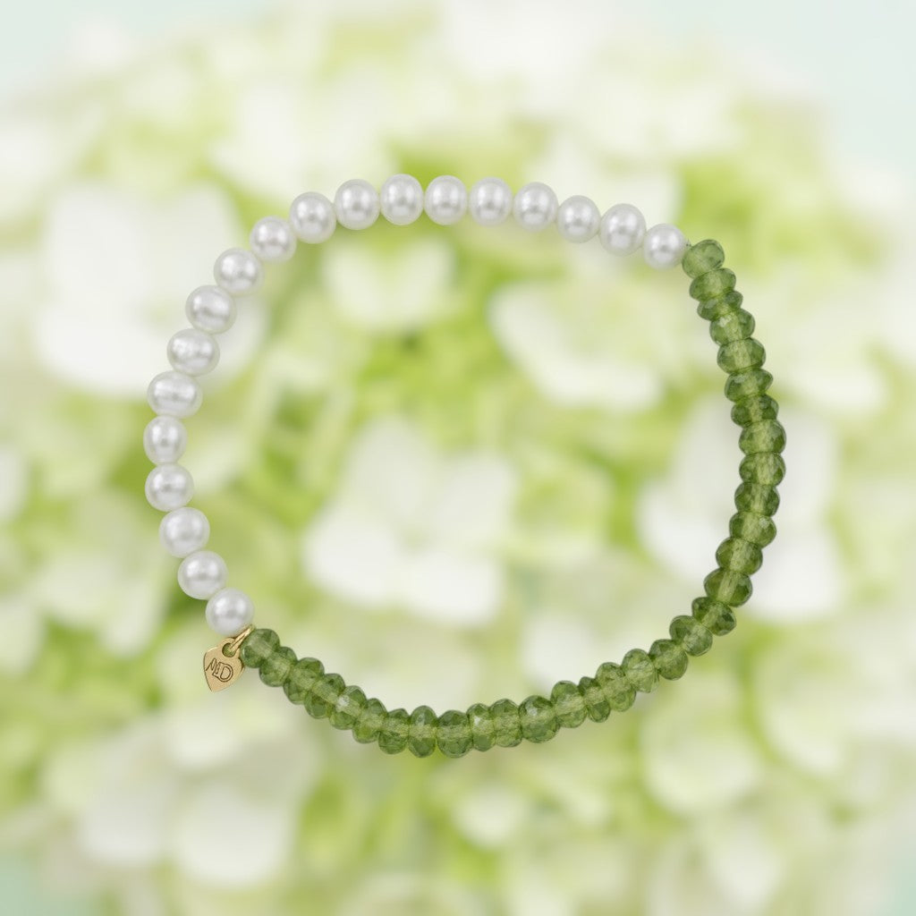 The Mermaid's Den Limelight Hydrangea bracelet featuring olive-green peridot gemstones and white freshwater pearls.
